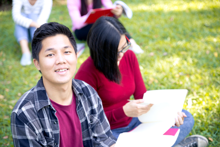 Group of university students having fun outdoorsの写真素材