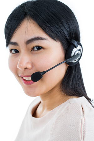 Portrait of happy smiling cheerful support phone operator in headset, isolated on white backgroundの写真素材