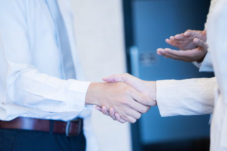 Business people shaking hands, finishing up a meetingの写真素材