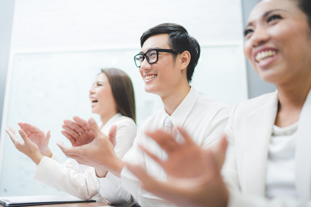 Cropped image of businesspeople clapping.の写真素材