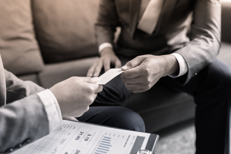 business executive exchanging business cardの写真素材