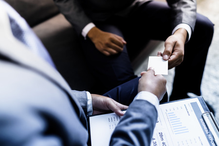 business executive exchanging business card