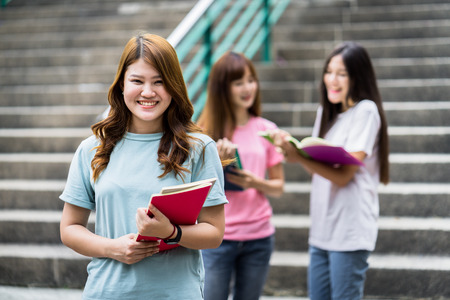 group of happy teen high school students outdoorsの写真素材