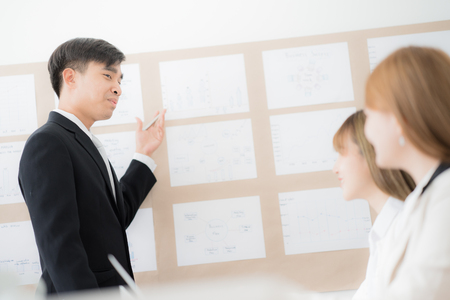 Businessman presenting financial to partners in office. Asian peopleの写真素材