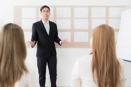 Businessman presenting financial to partners in office. Asian peopleの写真素材
