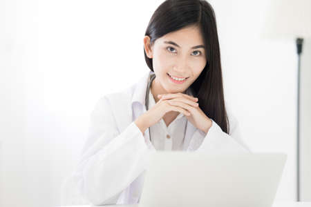 Smiling medical doctor woman with stethoscope. Asian peopleの写真素材