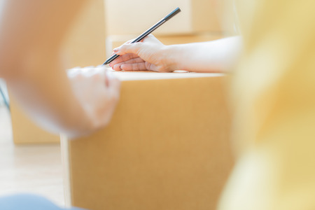 Young Asian woman working online shopping at home officeの写真素材