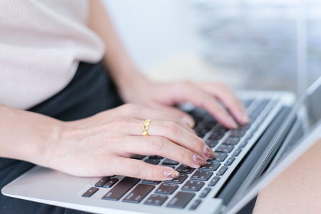 Business women reviewing data in financial charts and graphs in the officeの写真素材