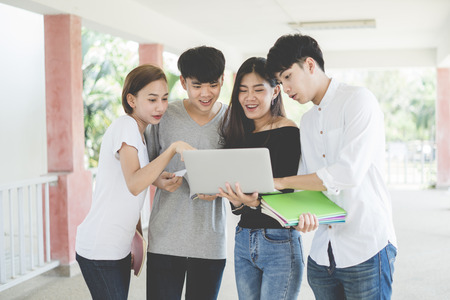 Group of happy teen high school students outdoorsの写真素材