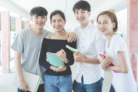 Group of happy teen high school students outdoorsの写真素材