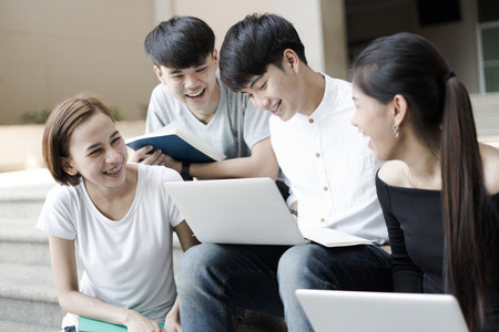 Group of happy teen high school students outdoors. Asianの写真素材