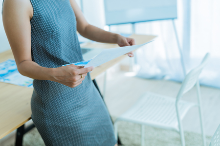 Business women reviewing data in financial charts and graphs. Accountingの写真素材