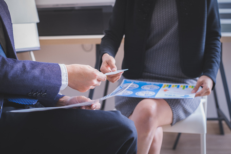 business executive exchanging business cardの写真素材