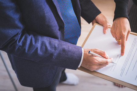 Business man signing a contract