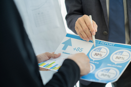 Business partners discussing documents and ideas at meetingの写真素材