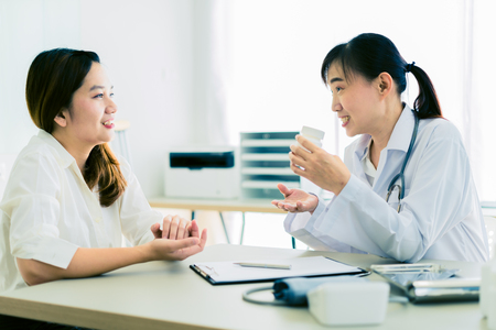 Female doctor consulting patient. Asian peopleの写真素材