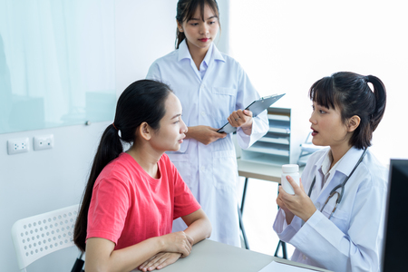 Female doctor consulting patient. Asian peopleの写真素材