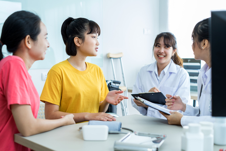 Female doctor consulting patient. Asian peopleの写真素材
