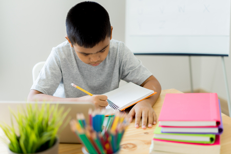 Asian little boy drawing at home. Education conceptの写真素材