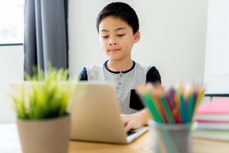 Asian little boy drawing at home. Education conceptの写真素材
