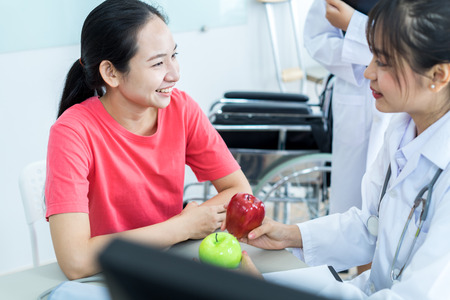 Female doctor consulting patient. Asian peopleの写真素材