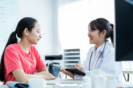 Female doctor consulting patient. Asian peopleの写真素材