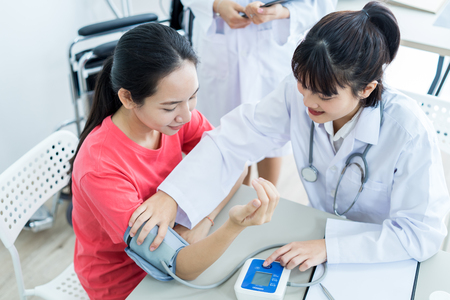 Female doctor consulting patient. Asian peopleの写真素材