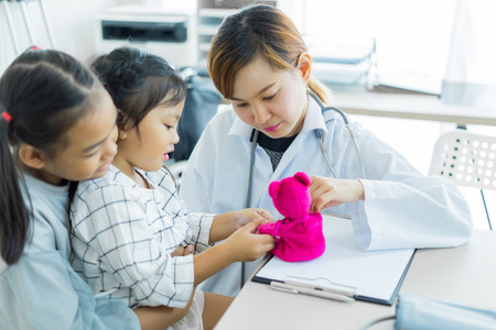 Asian cute girl visiting a doctor. Medicine and children's therapy conceptの写真素材