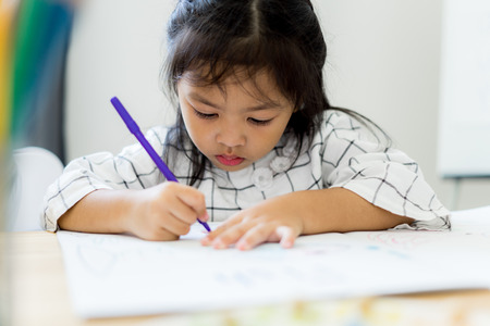 Asian cute little child girl drawing at home. Education conceptの写真素材