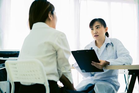 Female doctor consulting patient. Asian peopleの写真素材