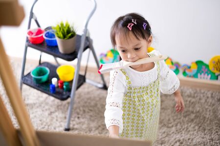 Asian cute little child girl drawing at home.の写真素材