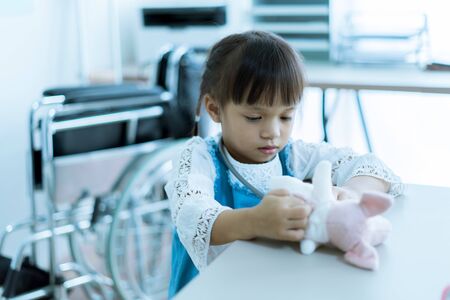 Asian little girl visiting a doctor.の写真素材