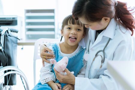 Asian cute girl visiting a doctorの写真素材