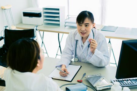 Female doctor consulting patient.の写真素材