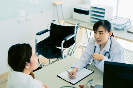 Female doctor consulting patient.の写真素材
