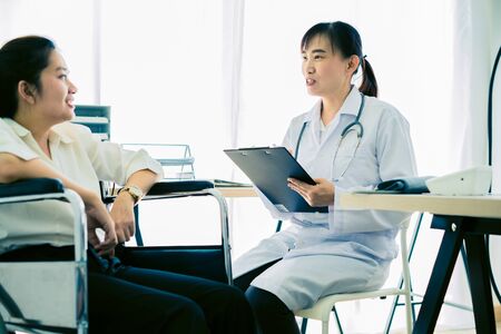 Female doctor consulting patient. Asian peopleの写真素材