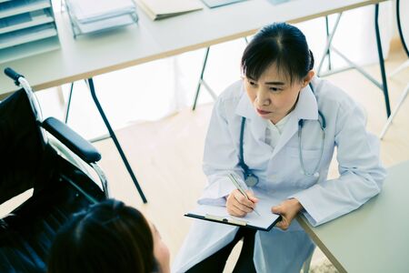 Female doctor consulting patient. Asian peopleの写真素材