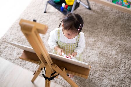 Asian cute little child girl drawing at home. Education conceptの写真素材