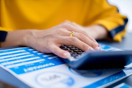 Business women reviewing data in financial charts and graphs. Accounting