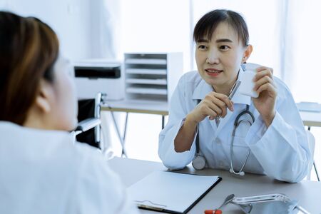 Female doctor consulting patient. Asian peopleの写真素材