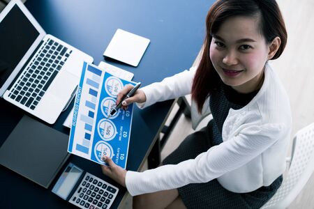 Business women reviewing data in financial statement. Accountingの写真素材