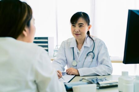 Female doctor consulting patient. Asian peopleの写真素材