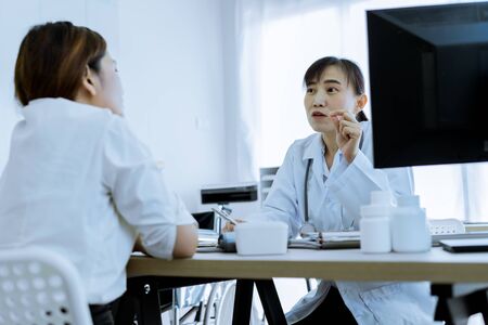 Female doctor consulting patient. Asian peopleの写真素材