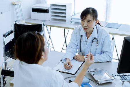 Female doctor consulting patient. Asian peopleの写真素材