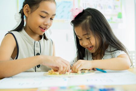 Asian cute little child girl drawing at homeの写真素材
