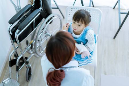 Asian cute girl visiting a doctorの写真素材