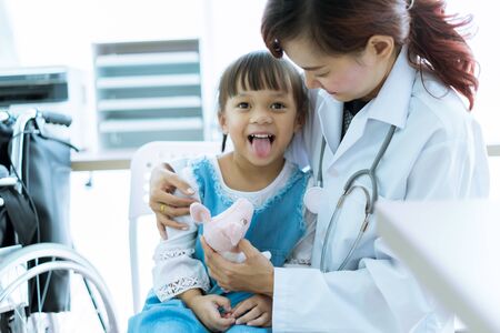 Asian cute girl visiting a doctorの写真素材