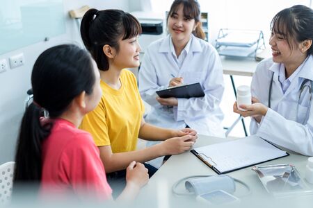 Female doctor consulting patient. Asian peopleの写真素材