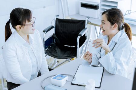 Female doctor consulting patient. Asian peopleの写真素材