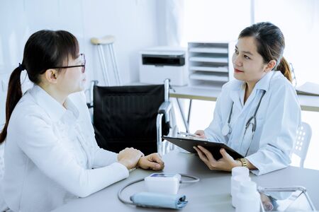 Female doctor consulting patient. Asian peopleの写真素材